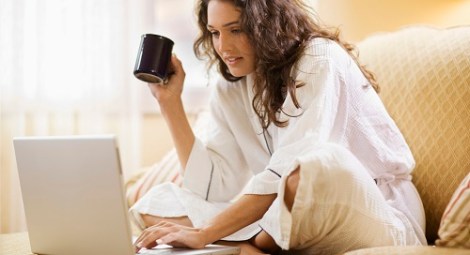 Woman working at home with laptop computer